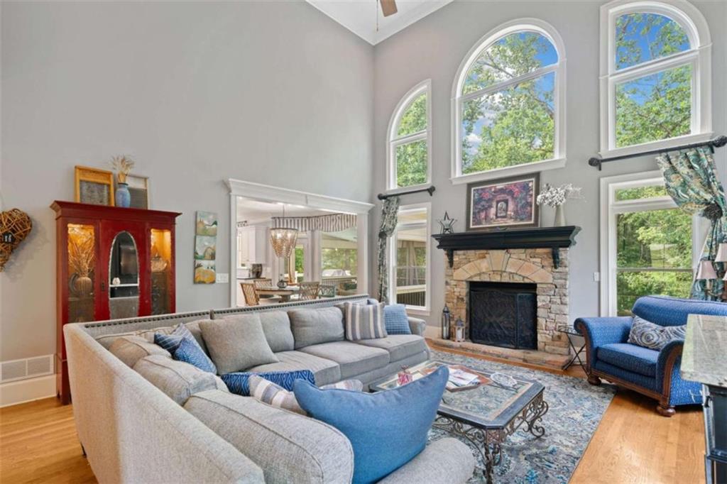 380 Creek Point Milton, GA 30004 - Photo 19 of 74 a living room with furniture fireplace and a large window