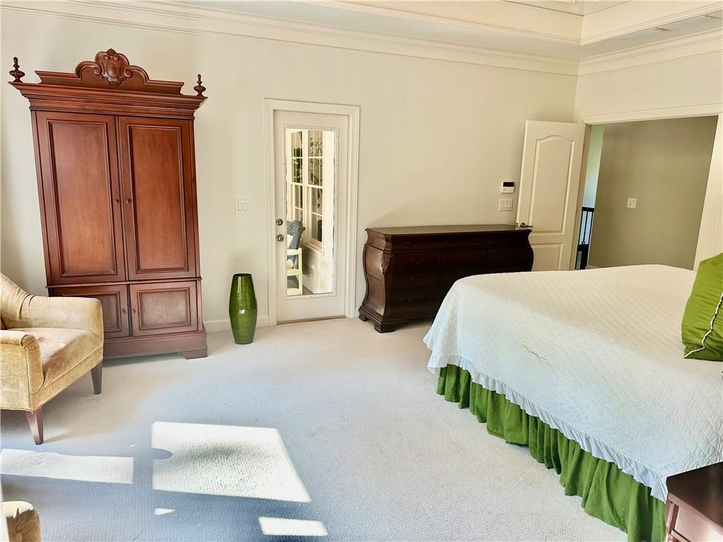 380 Creek Point Milton, GA 30004 - Photo 35 of 74 a bedroom with a bed and a couch