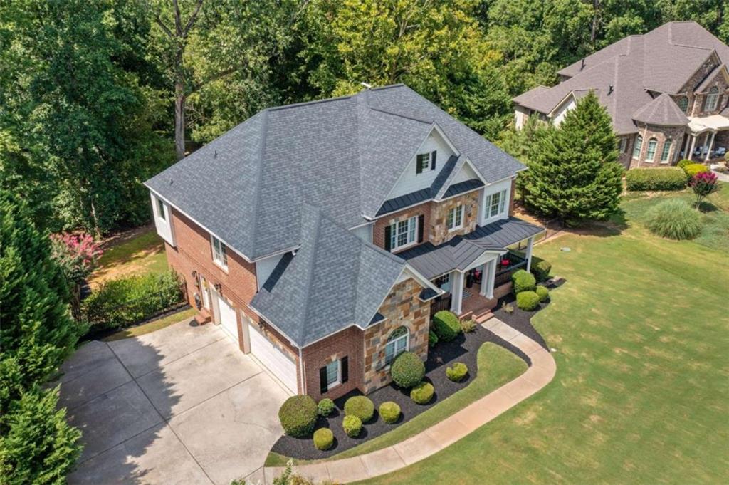 380 Creek Point Milton, GA 30004 - Photo 4 of 74 an aerial view of a house with a yard basket ball court and outdoor seating