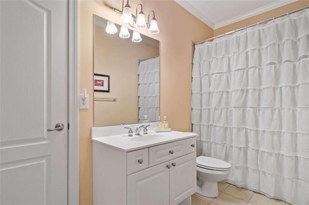 380 Creek Point Milton, GA 30004 - Photo 47 of 74 a bathroom with a sink a toilet and a mirror