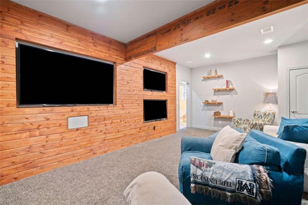 380 Creek Point Milton, GA 30004 - Photo 50 of 74 a living room with furniture and a flat screen tv
