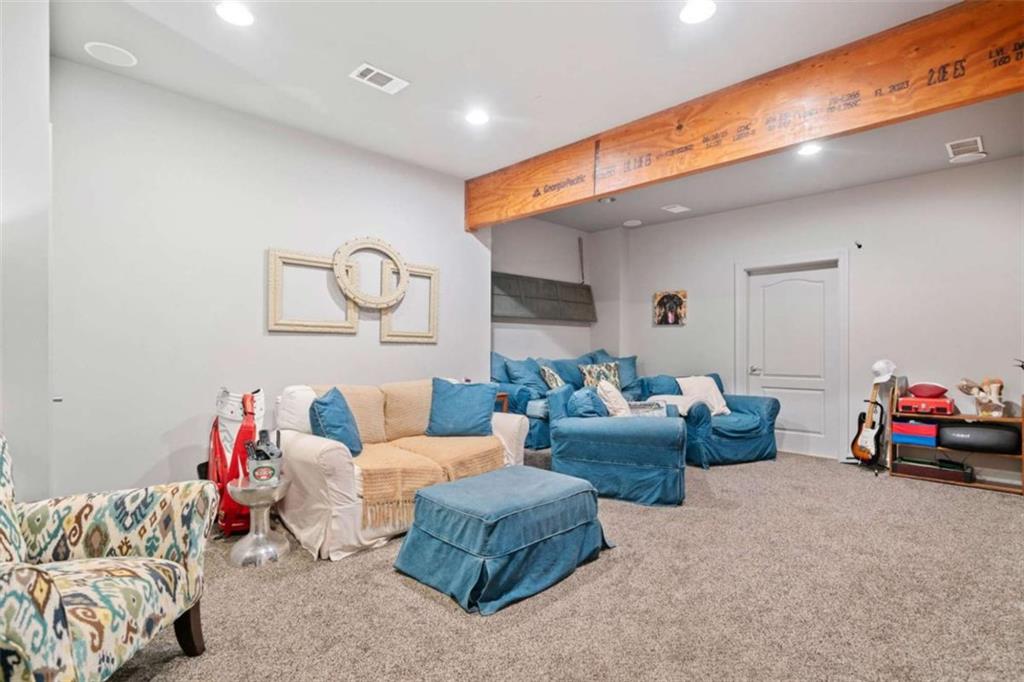 380 Creek Point Milton, GA 30004 - Photo 51 of 74 a living room with furniture and a couch