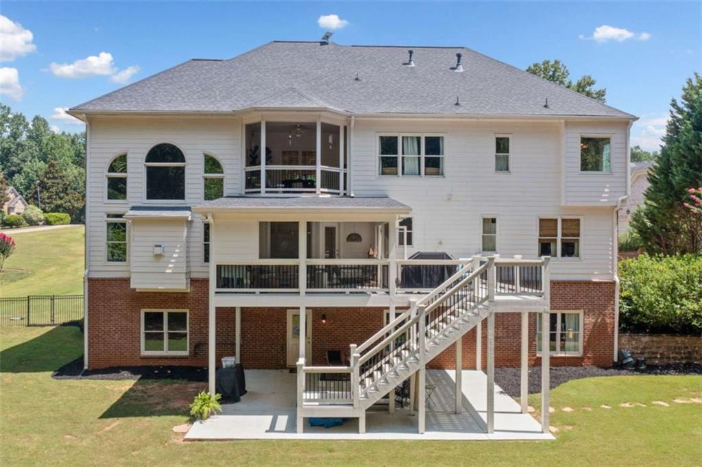 380 Creek Point Milton, GA 30004 - Photo 57 of 74 a view of a house with wooden deck and living room