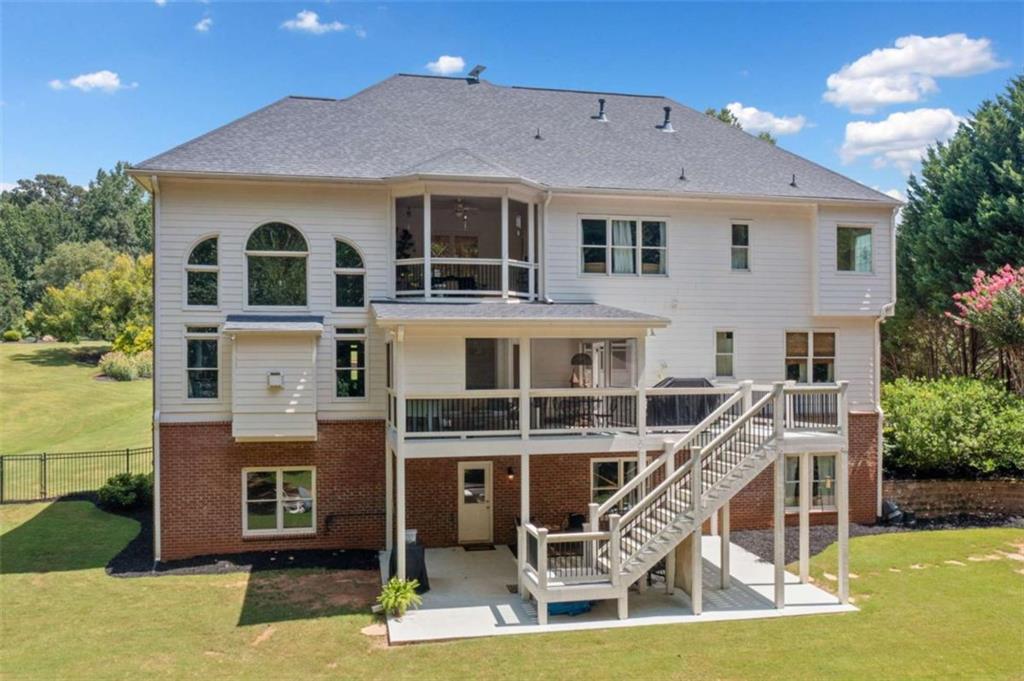 380 Creek Point Milton, GA 30004 - Photo 58 of 74 a view of a house with a backyard