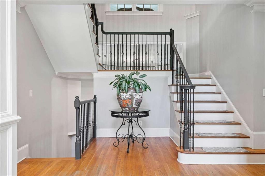 380 Creek Point Milton, GA 30004 - Photo 7 of 74 a view of a hallway with wooden floor and stairs