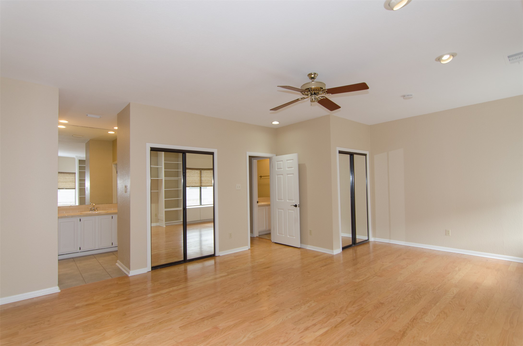 10819 Crown Colony Drive, Unit 38 Austin, TX 78747 - Photo 13 of 28 an empty room with fan and entrance
