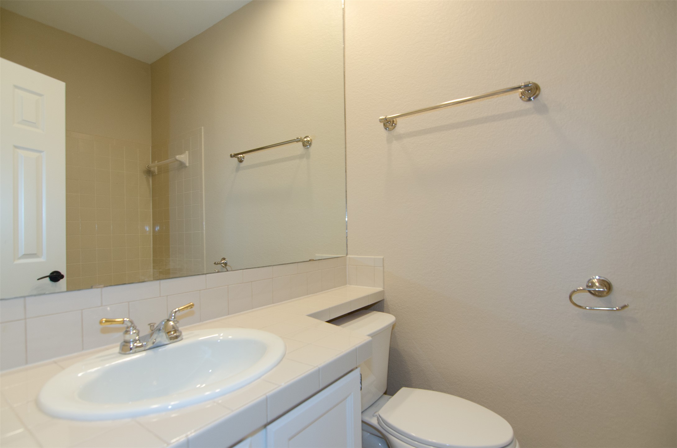 10819 Crown Colony Drive, Unit 38 Austin, TX 78747 - Photo 18 of 28 a bathroom with a sink toilet and shower