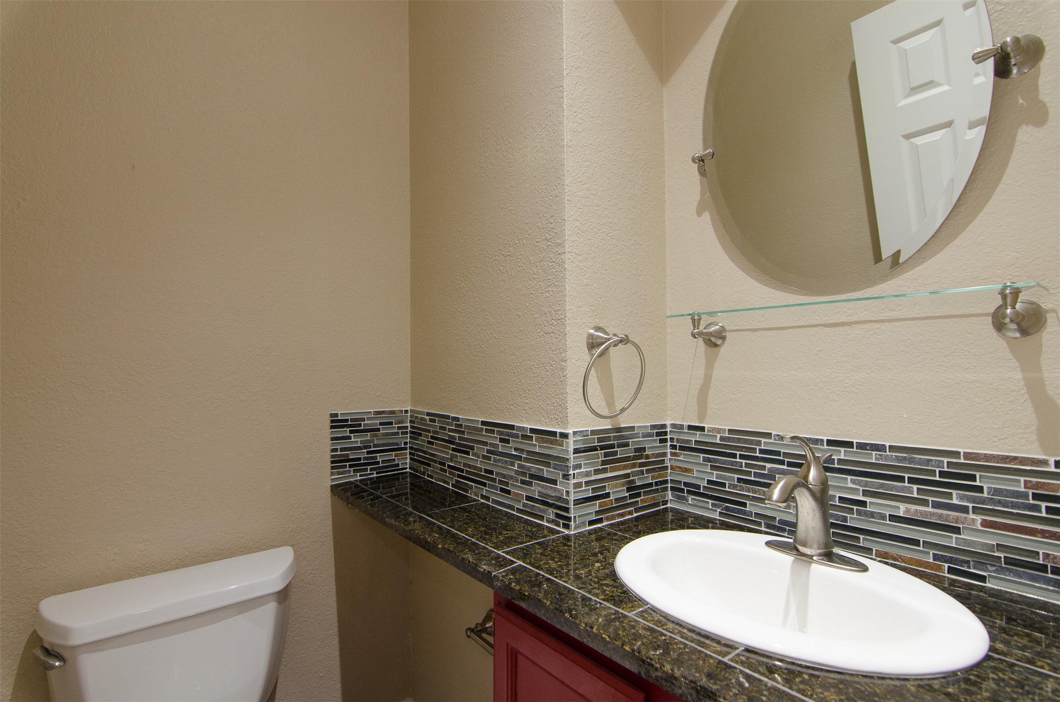 10819 Crown Colony Drive, Unit 38 Austin, TX 78747 - Photo 19 of 28 a bathroom with a sink and a mirror