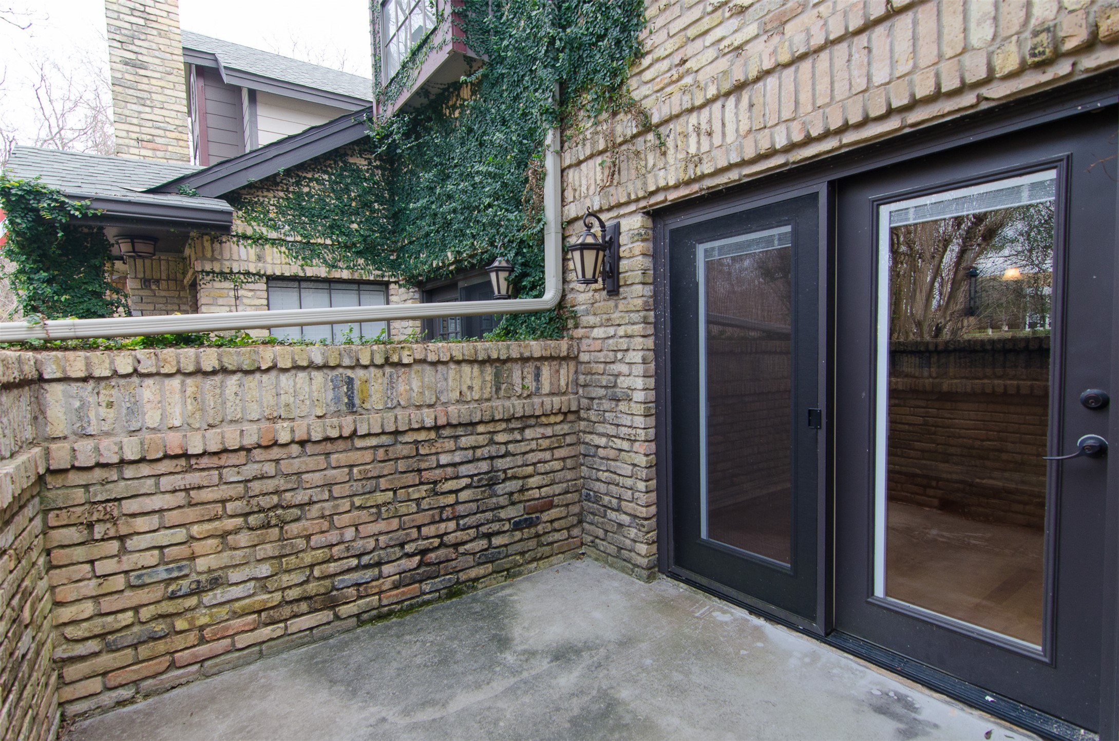 10819 Crown Colony Drive, Unit 38 Austin, TX 78747 - Photo 22 of 28 a view of outdoor space and brick wall