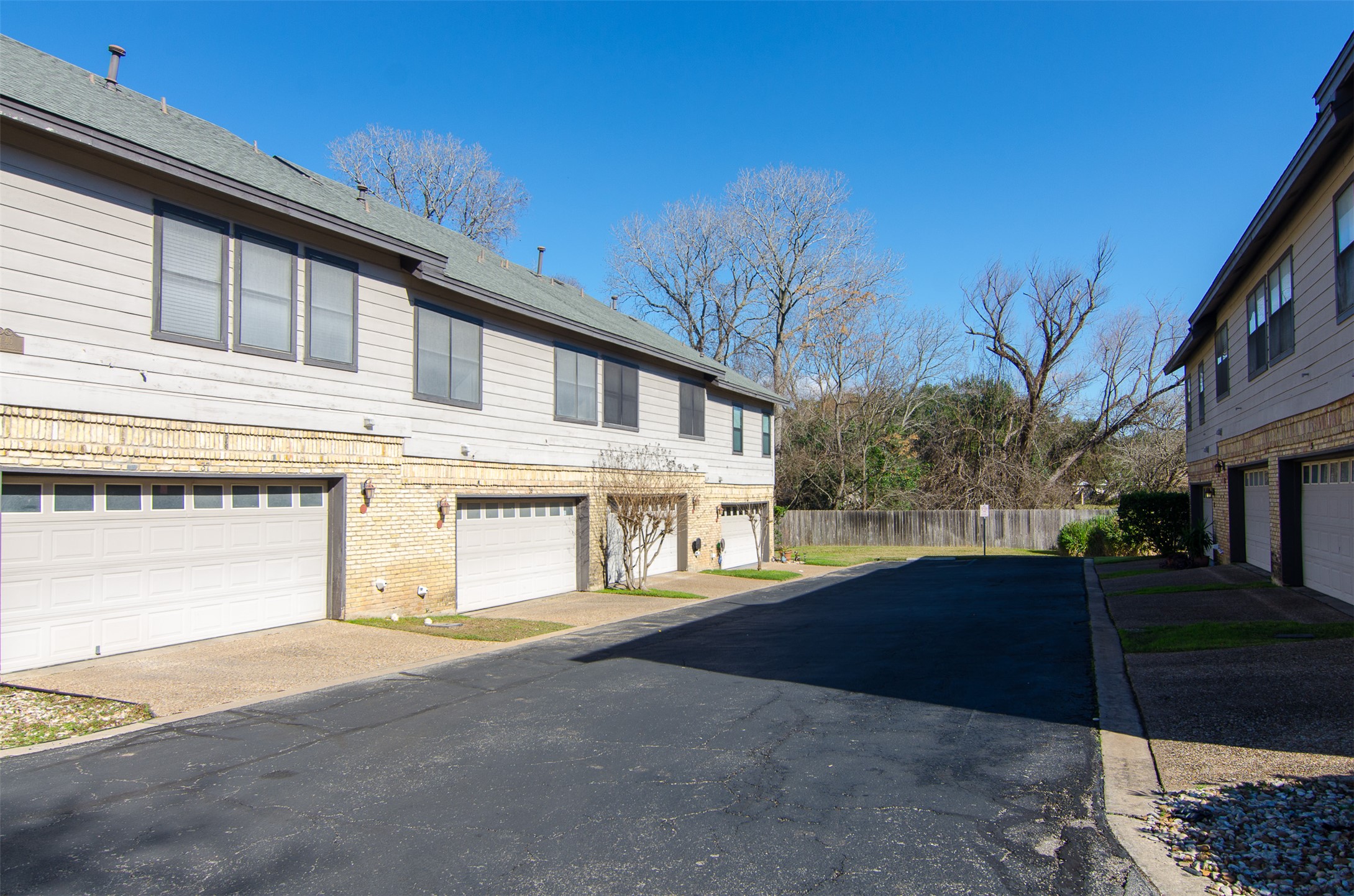 10819 Crown Colony Drive, Unit 38 Austin, TX 78747 - Photo 28 of 28 a front view of a house with a yard