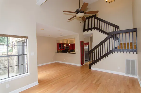 a view of staircase with wooden floor and a window