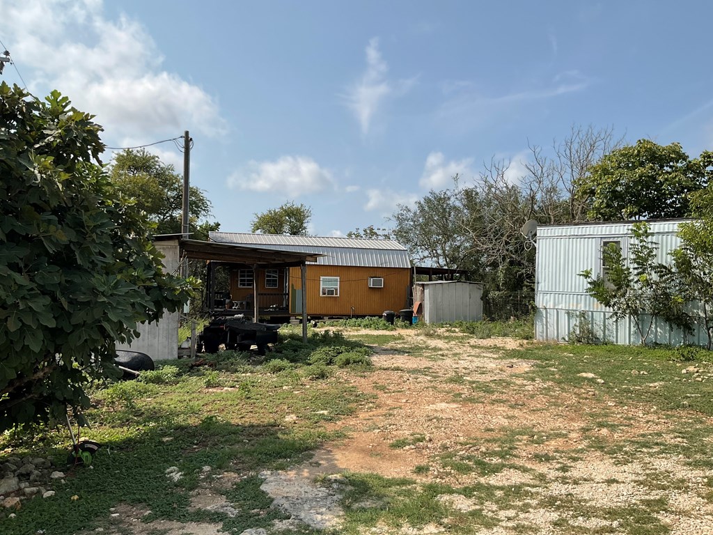 313 Elm Pass II Road East Center Point, TX 78010 - Photo 4 of 37 a view of a house with a yard