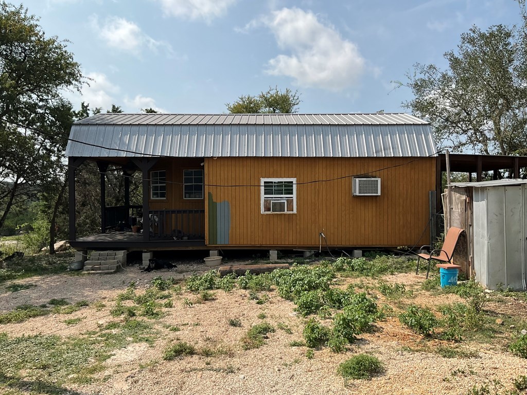 313 Elm Pass II Road East Center Point, TX 78010 - Photo 5 of 37 a view of a house with a yard