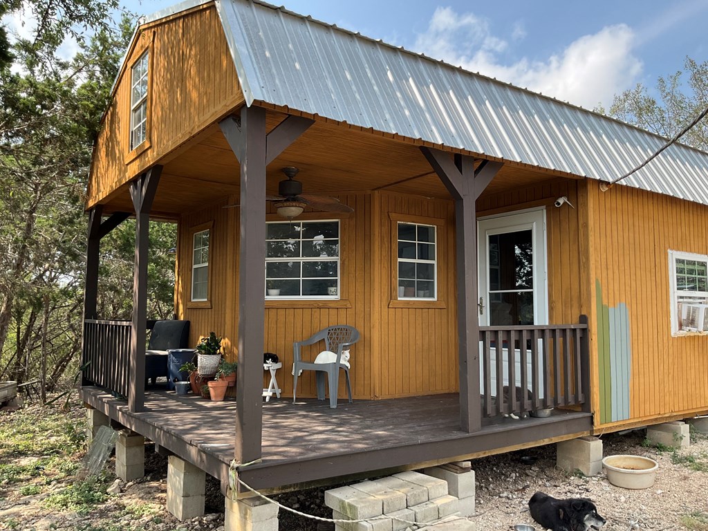 313 Elm Pass II Road East Center Point, TX 78010 - Photo 7 of 37 a backyard of a house with barbeque oven