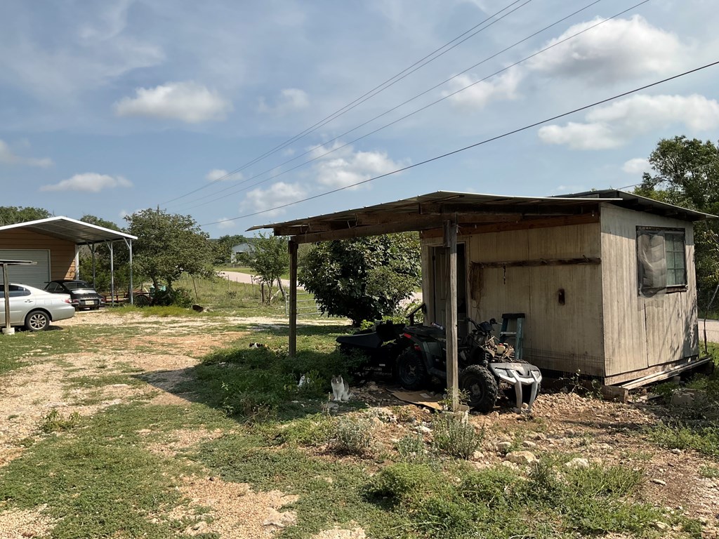 313 Elm Pass II Road East Center Point, TX 78010 - Photo 8 of 37 a view of a house with backyard and sitting area