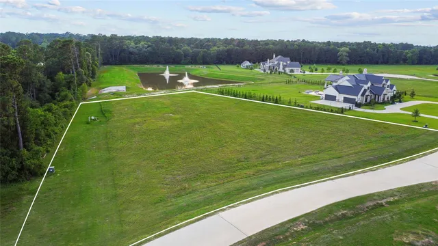 a view of a field with a big yard