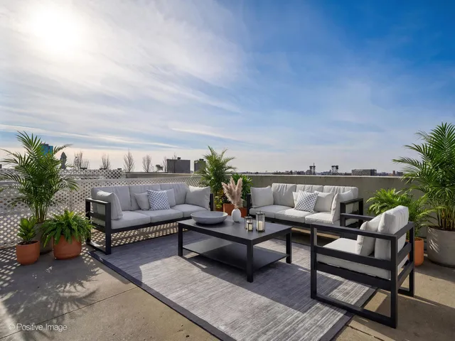 a outdoor living space with furniture and a potted plant