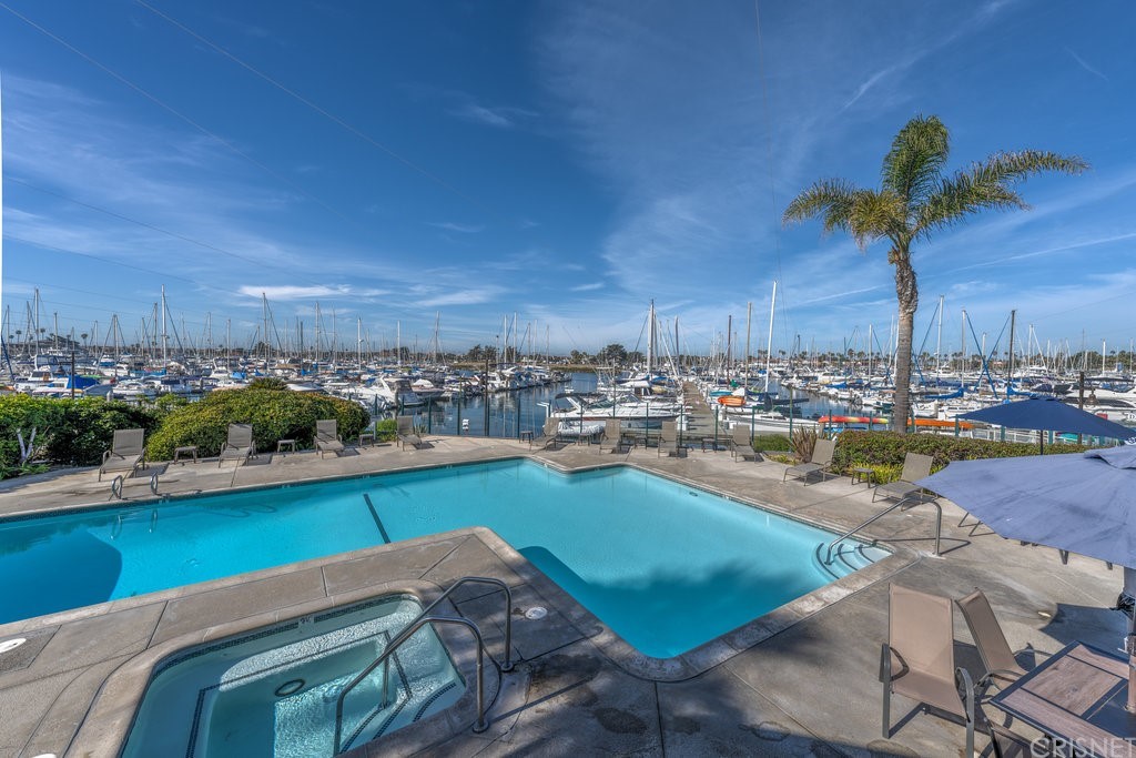 3101 Peninsula Road, Unit 108 Oxnard, CA 93035 - Photo 1 of 24 a view of a swimming pool with outdoor seating space