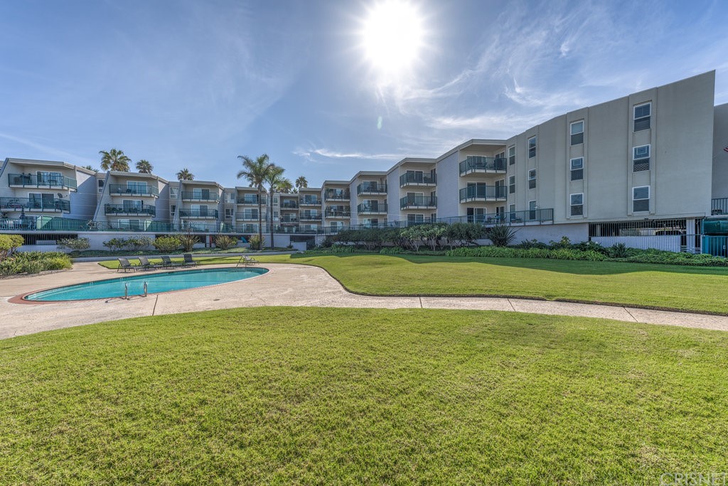 3101 Peninsula Road, Unit 108 Oxnard, CA 93035 - Photo 14 of 24 a view of a swimming pool with outdoor space and seating area