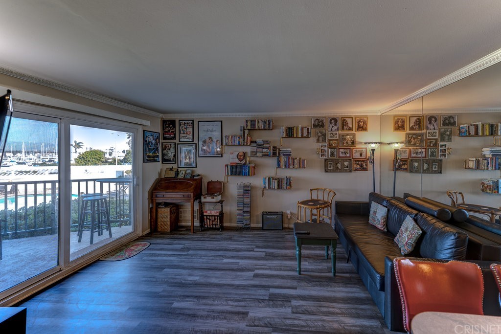 3101 Peninsula Road, Unit 108 Oxnard, CA 93035 - Photo 8 of 24 a living room with furniture and a large window