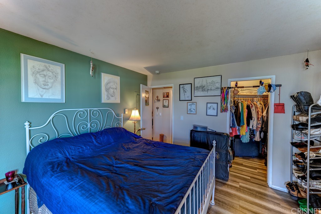 3101 Peninsula Road, Unit 108 Oxnard, CA 93035 - Photo 10 of 24 a living room with furniture and wooden floor