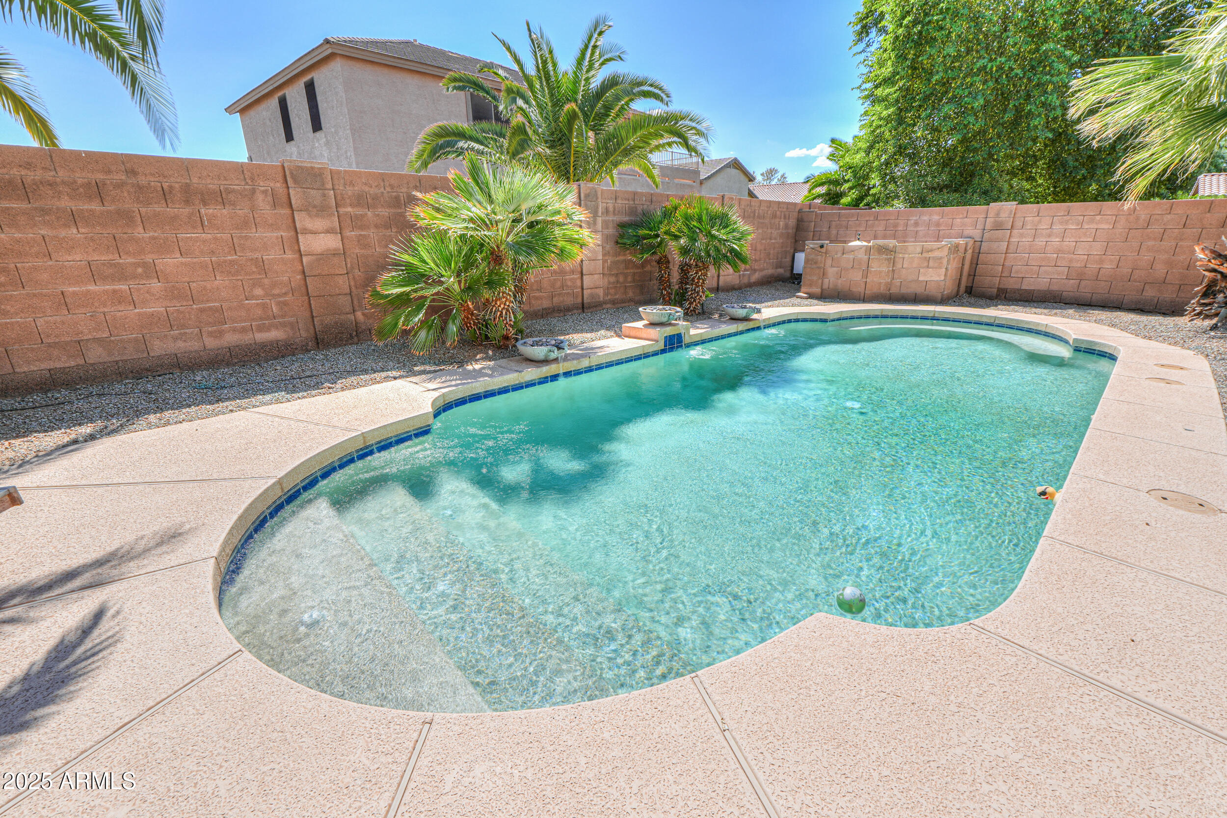 43223 West Venture Road Maricopa, AZ 85138 - Photo 12 of 70 a view of a backyard with a garden