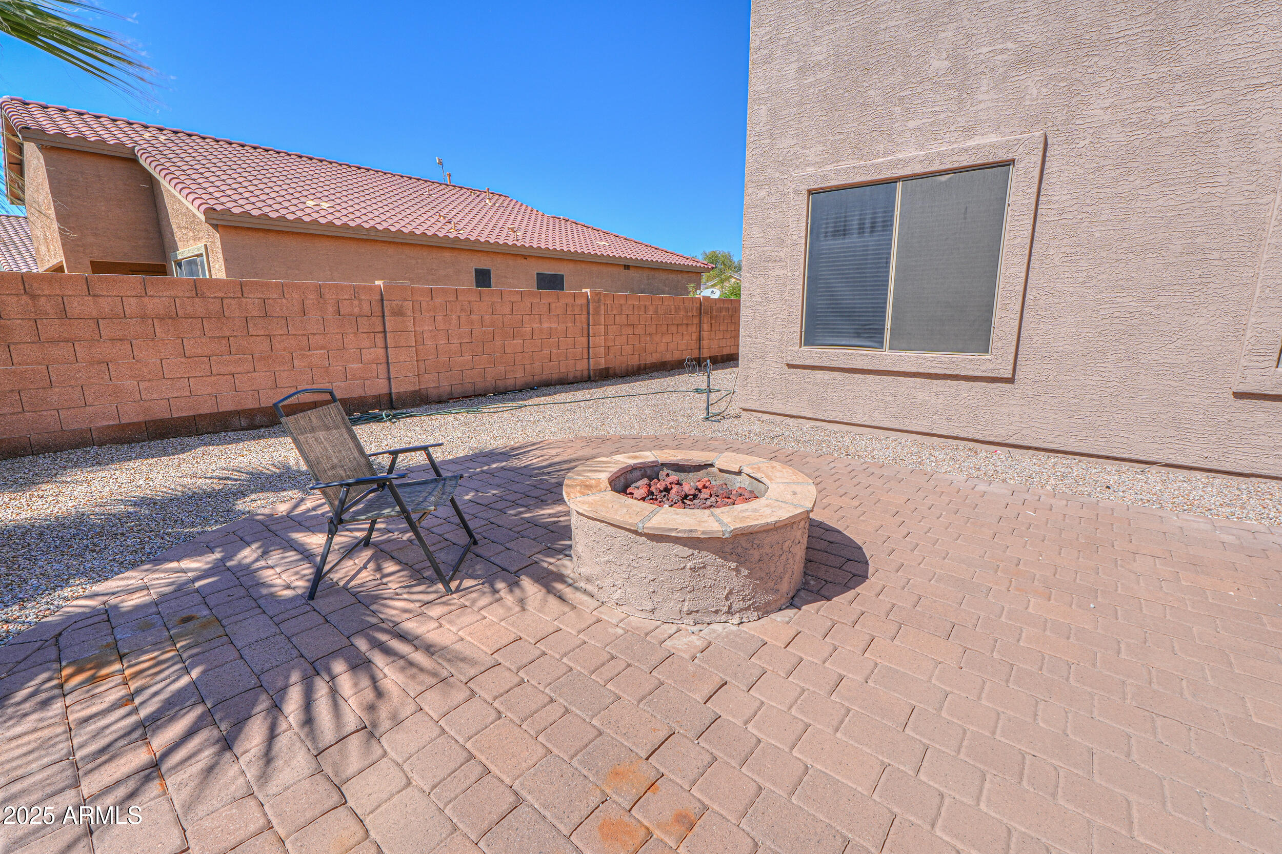 43223 West Venture Road Maricopa, AZ 85138 - Photo 23 of 70 a view of a chairs and table in backyard