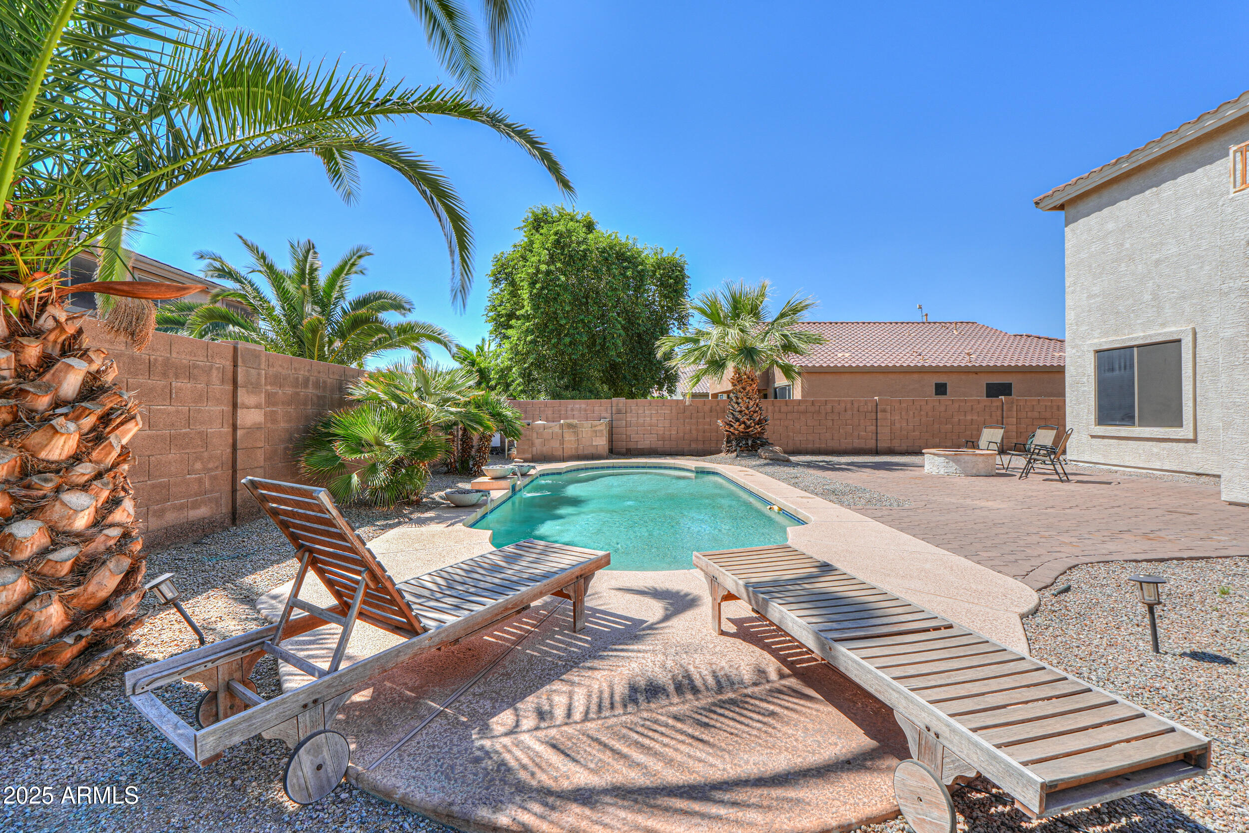 43223 West Venture Road Maricopa, AZ 85138 - Photo 3 of 70 a view of a backyard with plants and a patio