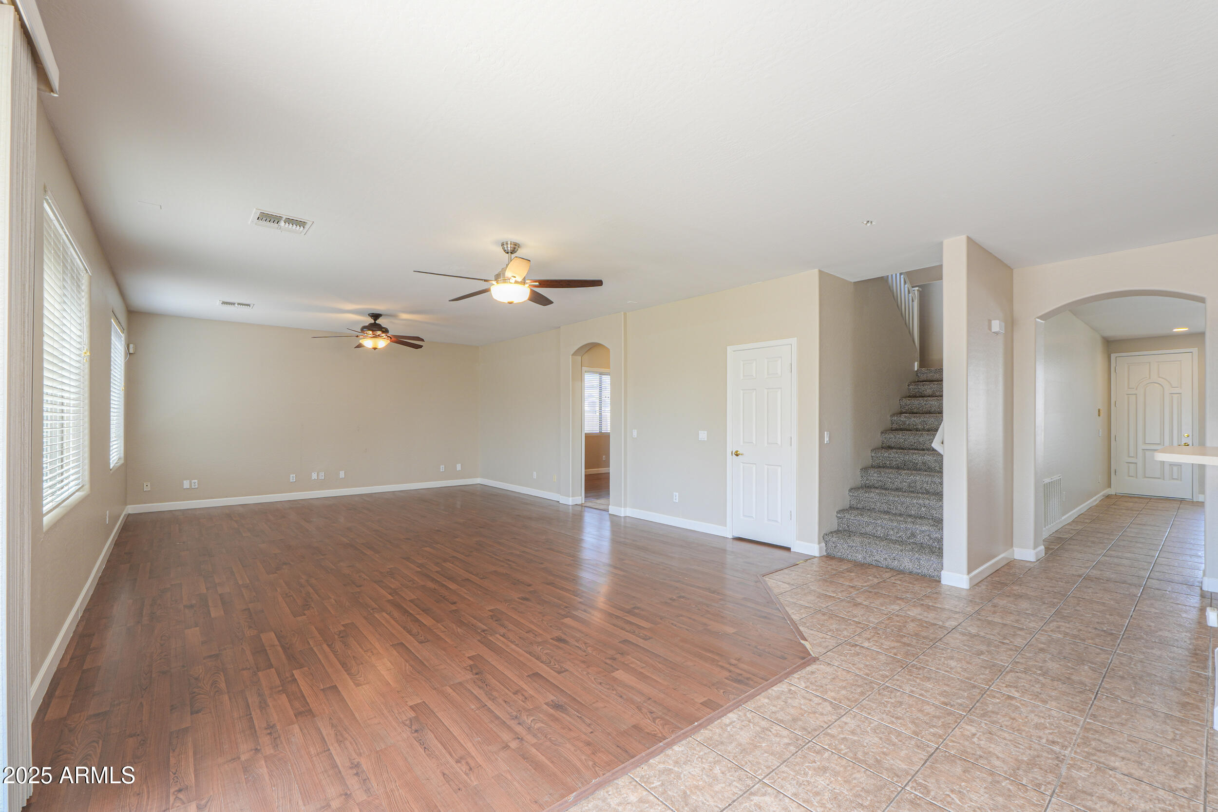 43223 West Venture Road Maricopa, AZ 85138 - Photo 31 of 70 wooden floor in an empty room with a window