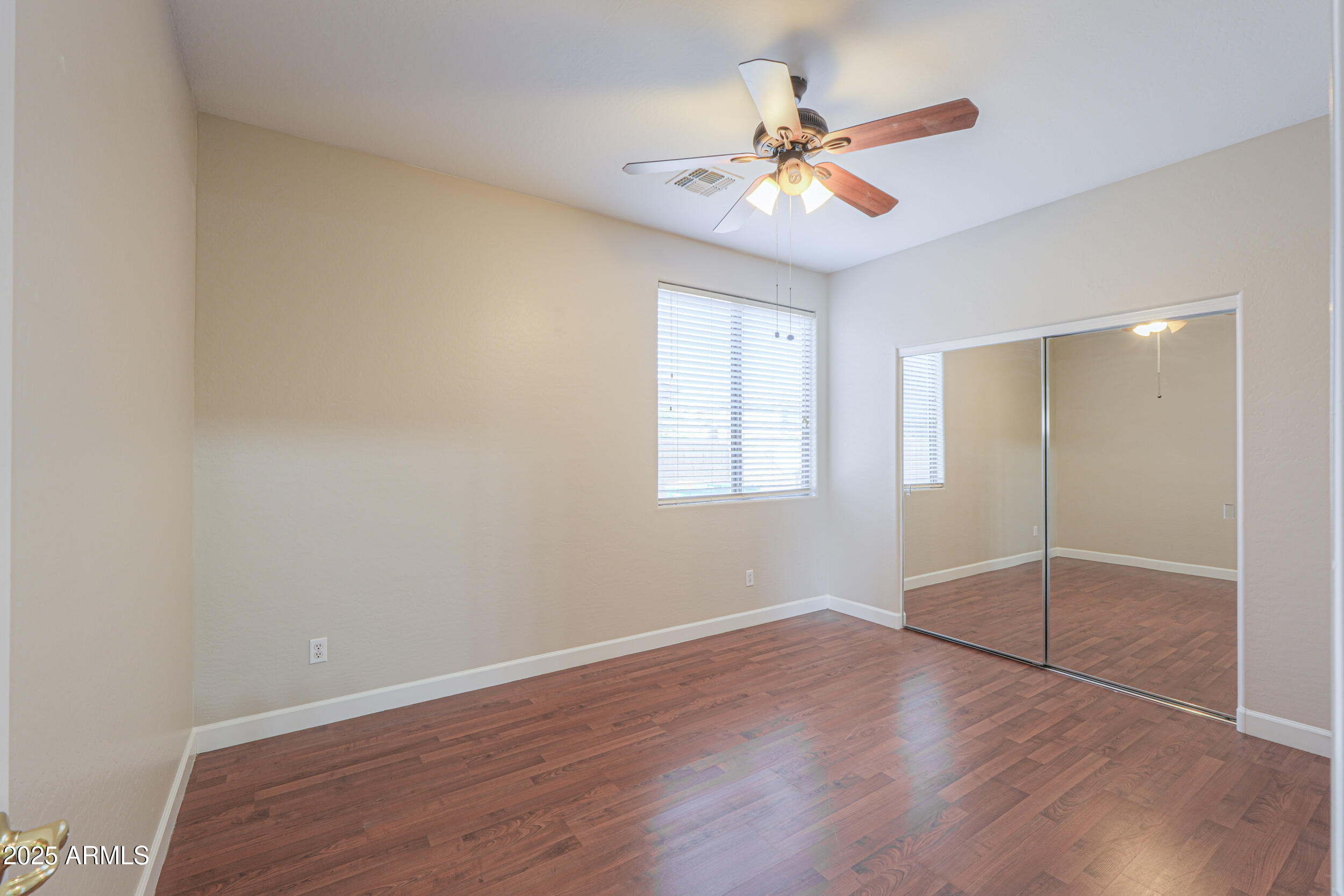 43223 West Venture Road Maricopa, AZ 85138 - Photo 34 of 70 wooden floor in an empty room with a window
