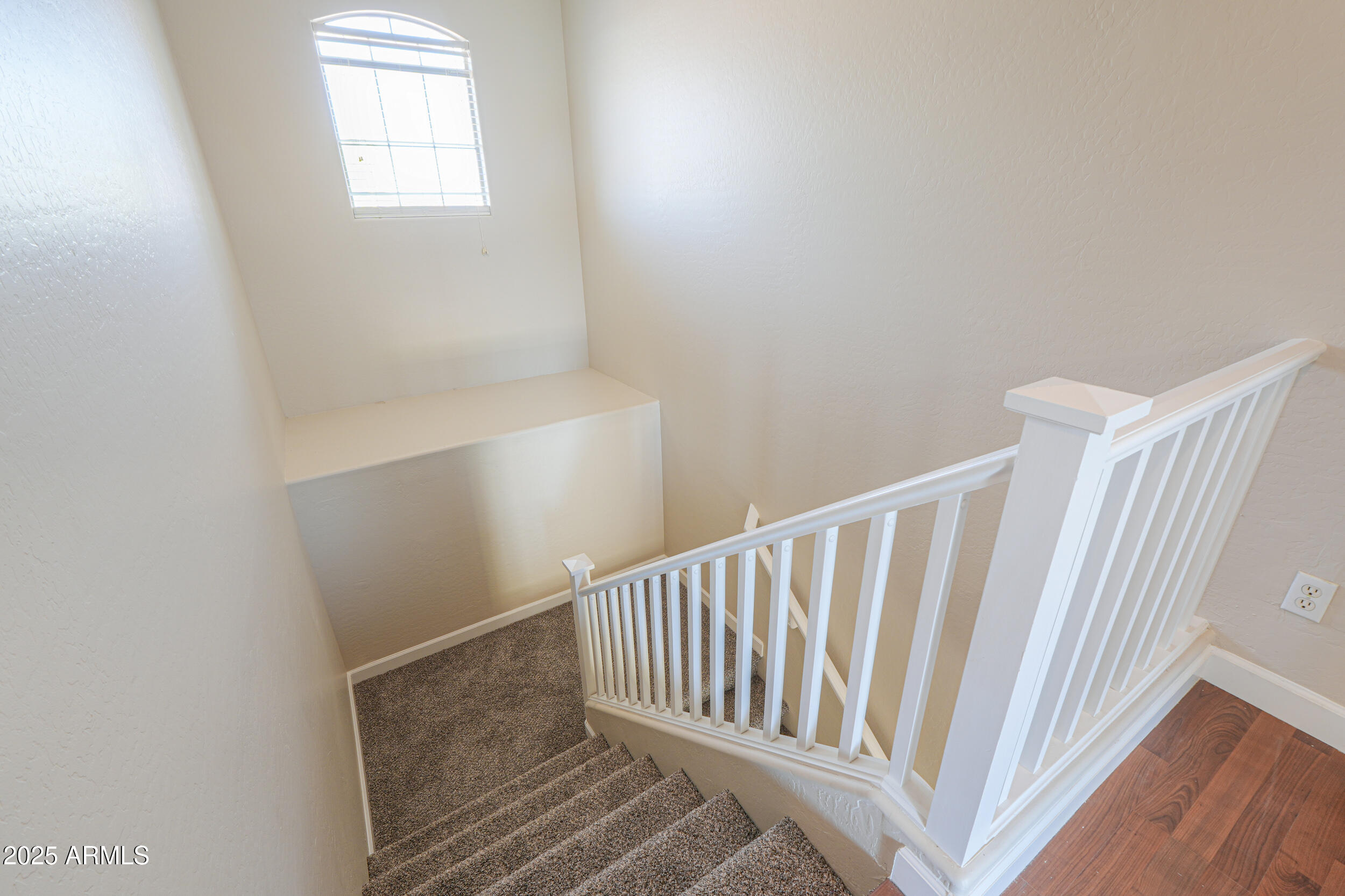43223 West Venture Road Maricopa, AZ 85138 - Photo 42 of 70 a view of staircase with white walls and a window