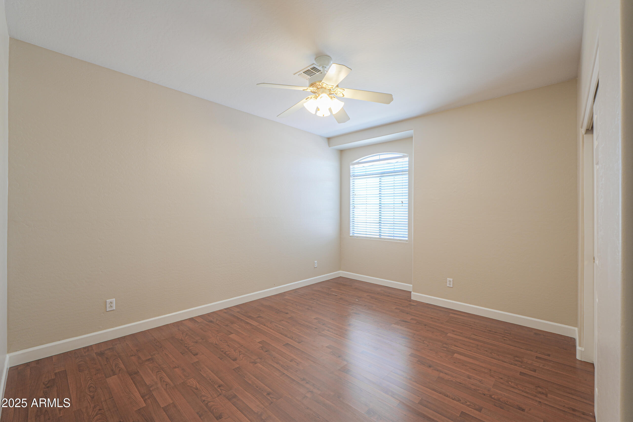 43223 West Venture Road Maricopa, AZ 85138 - Photo 48 of 70 wooden floor in an empty room with a window