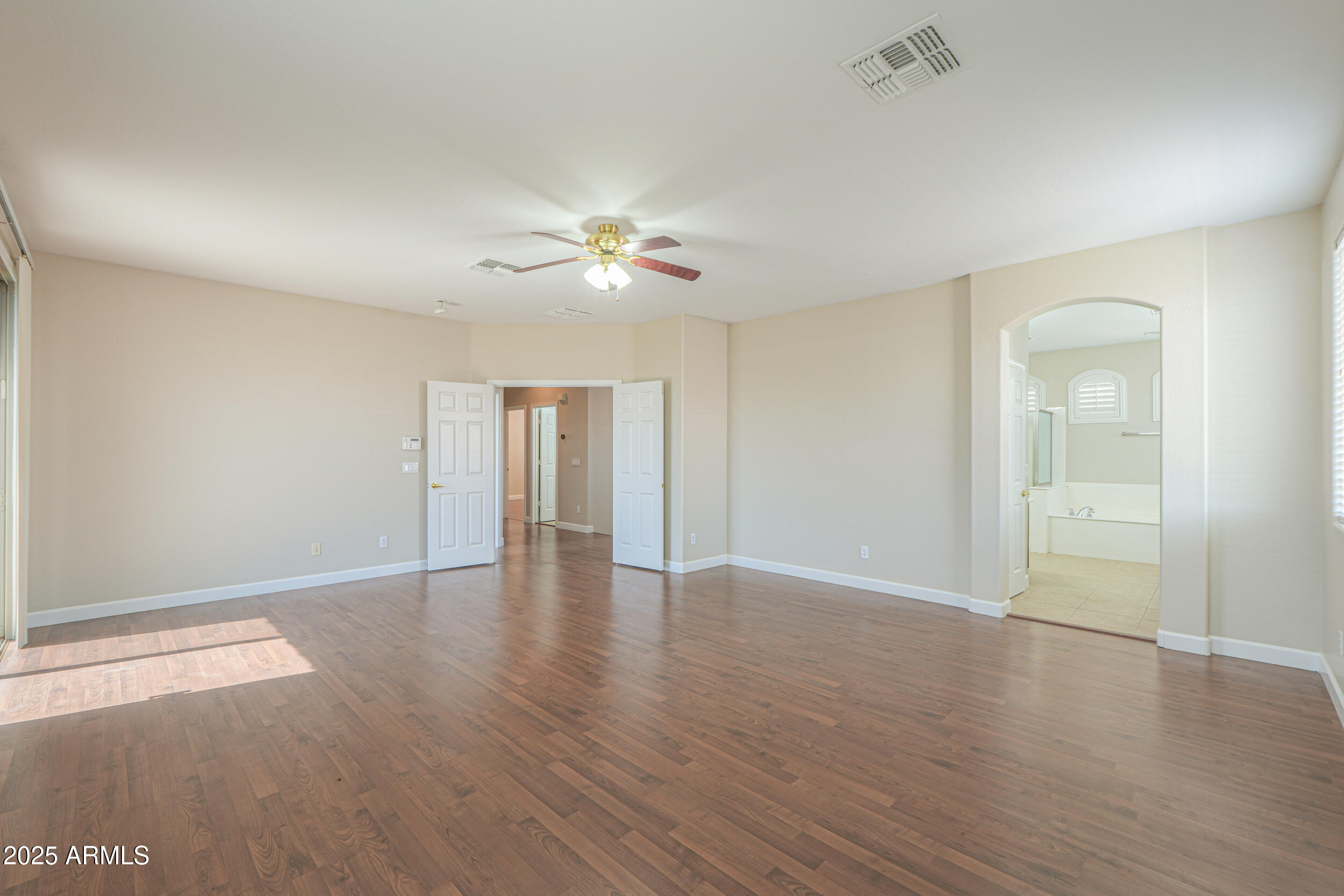 43223 West Venture Road Maricopa, AZ 85138 - Photo 54 of 70 wooden floor in an empty room with a window