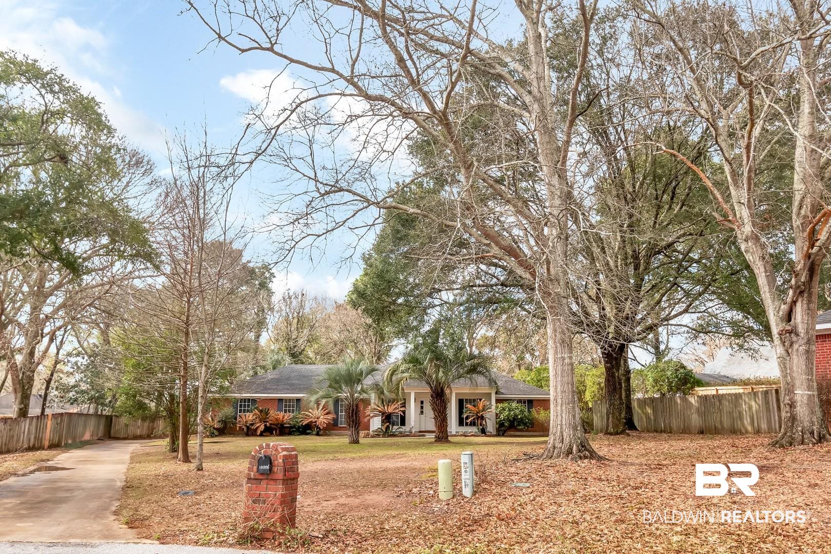 10006 Wedgefield Court Mobile, AL 36608 - Photo 10 of 34 View of front of home with a front yard and fence