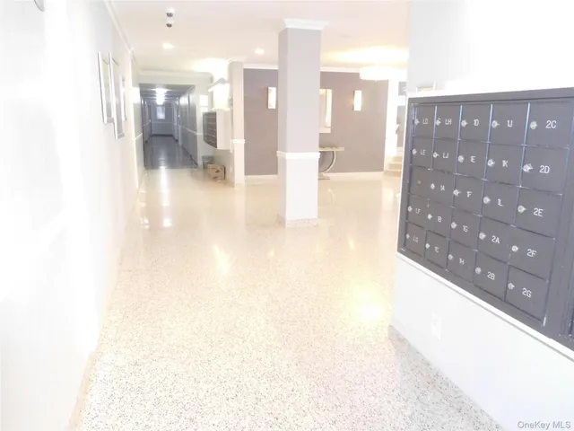 a view of hall with a dining table and chairs