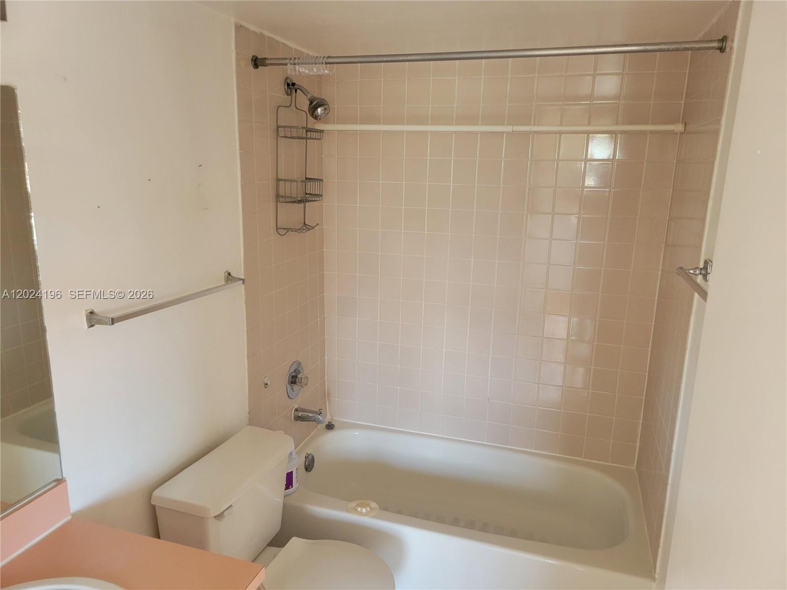 8260 Southwest 210th Street, Unit 319 Cutler Bay, FL 33189 - Photo 14 of 20 a bathroom with a bathtub and a shower