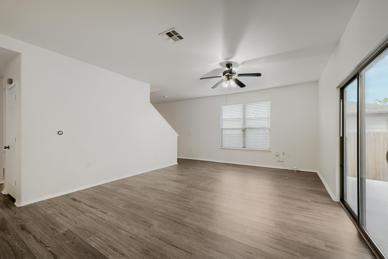 4508 Peach Grove Road Austin, TX 78744 - Photo 10 of 22 Clean white walls anchor this living space.