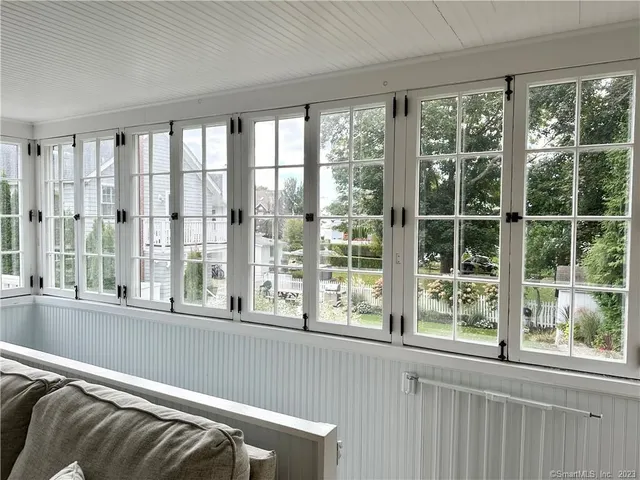 a view of a balcony with wooden floor