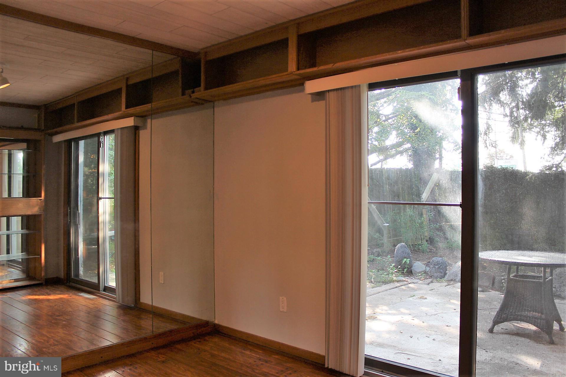 2 Center Road, Unit 2 Towson, MD 21286 - Photo 9 of 19 2nd BR has hardwood floor w/sliders to patio area!