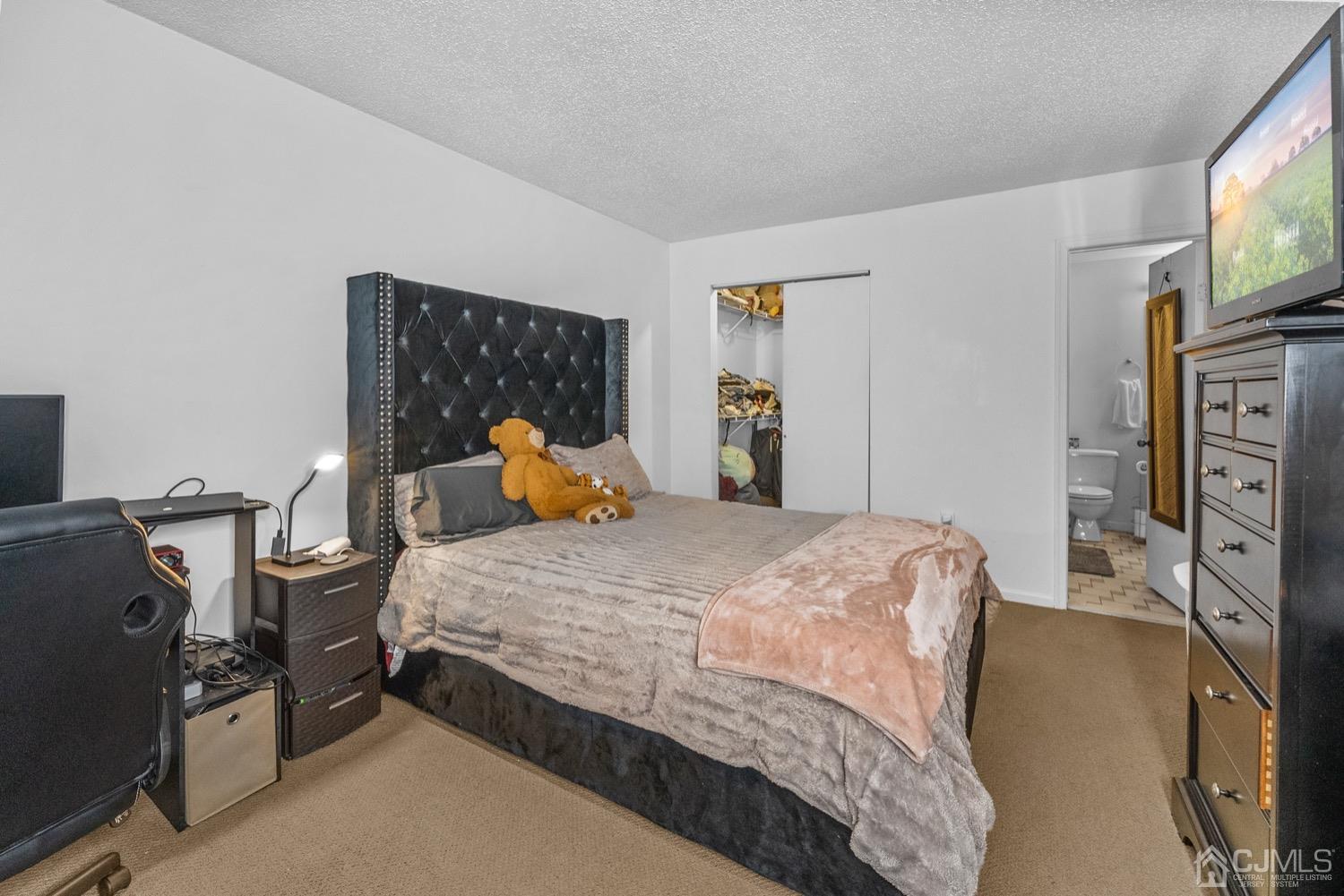 1237 Edpas Road New Brunswick, NJ 08901 - Photo 12 of 21 a bedroom with bed and tv