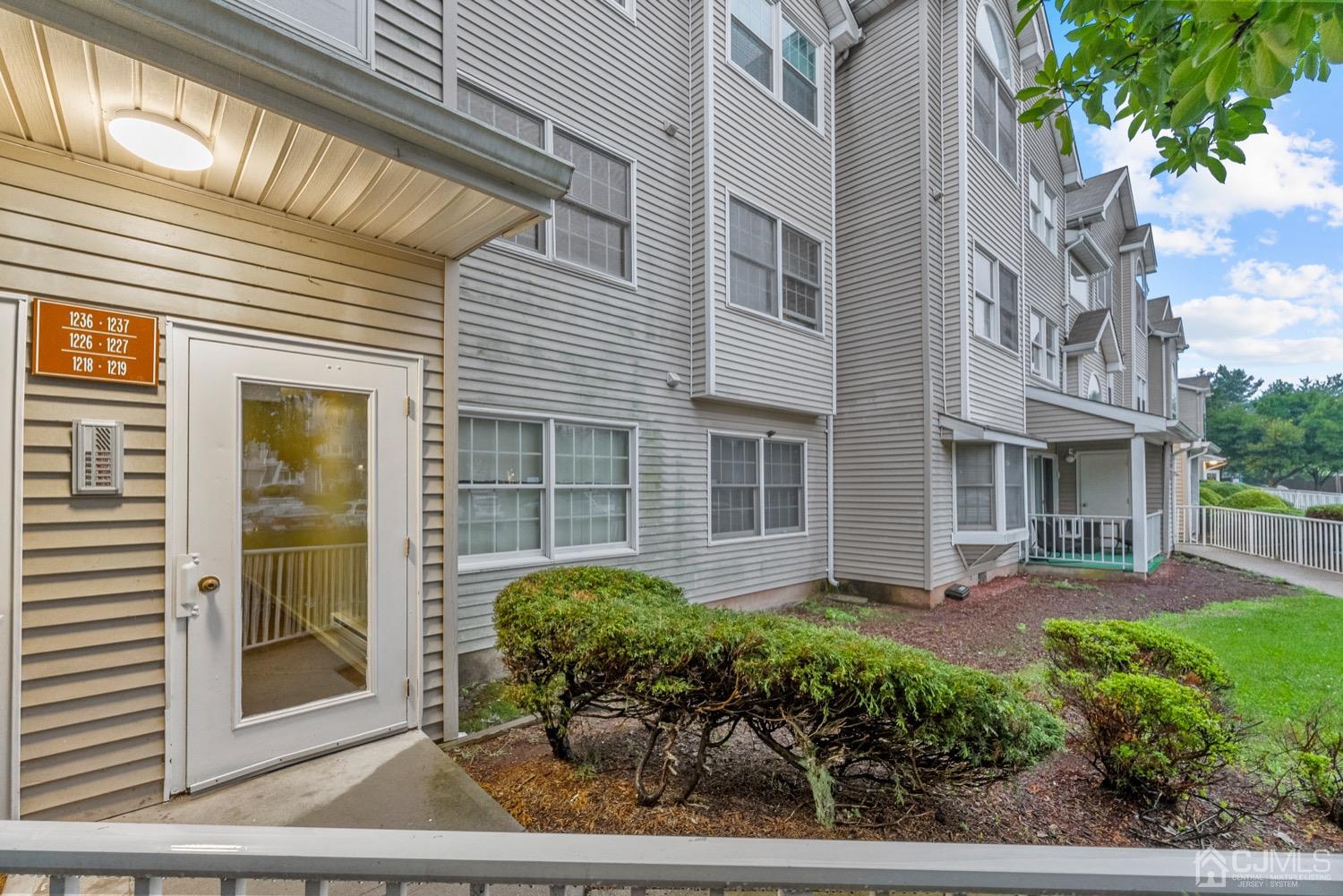 1237 Edpas Road New Brunswick, NJ 08901 - Photo 20 of 21 a view of a brick house with plants and large tree