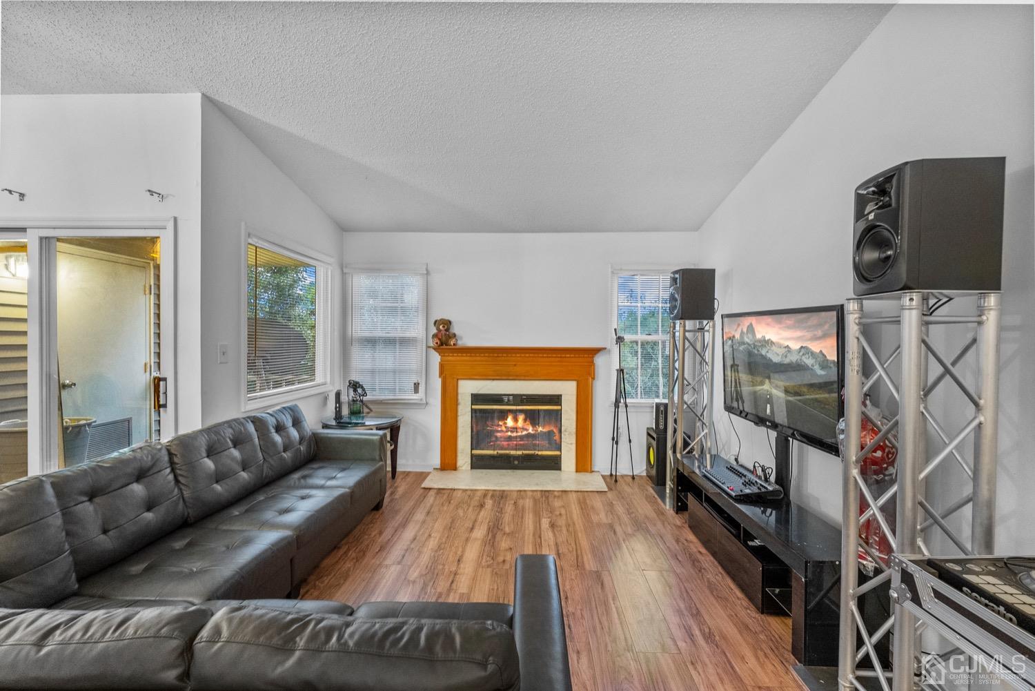 1237 Edpas Road New Brunswick, NJ 08901 - Photo 3 of 21 a living room with fireplace furniture and a flat screen tv