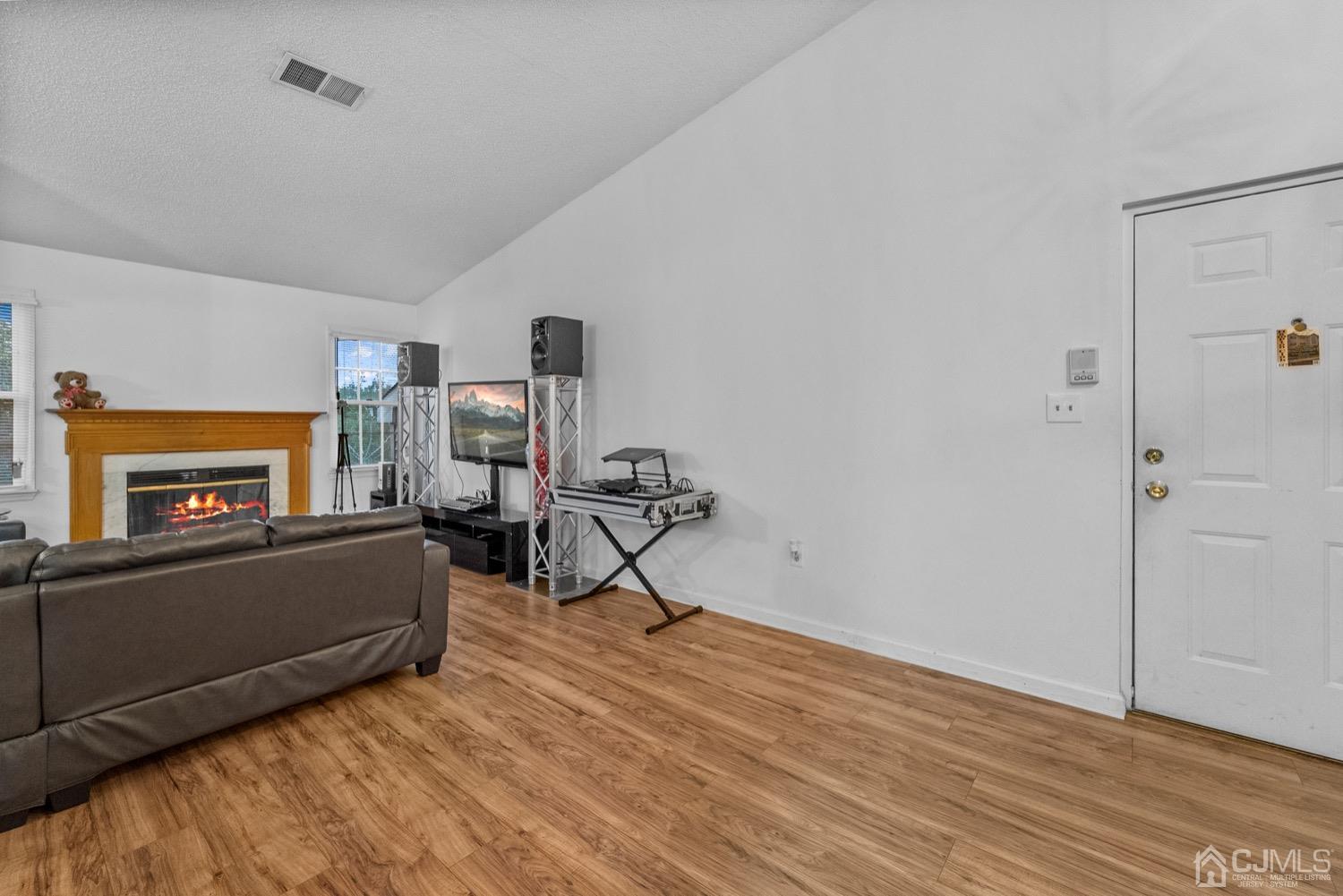 1237 Edpas Road New Brunswick, NJ 08901 - Photo 6 of 21 a living room with furniture and a fireplace
