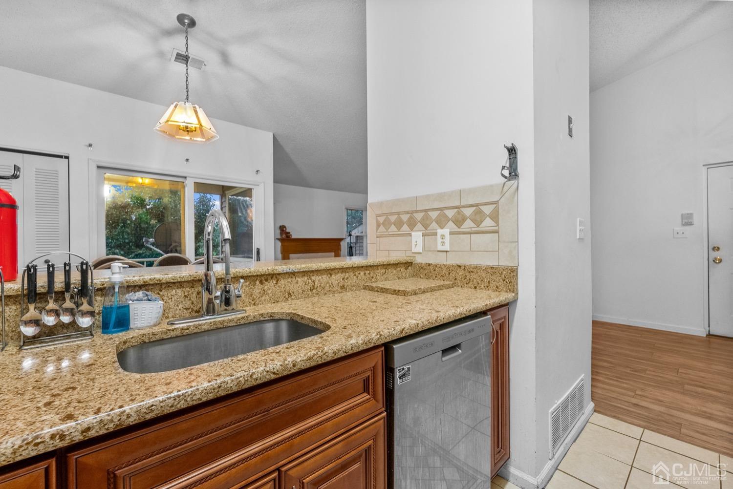 1237 Edpas Road New Brunswick, NJ 08901 - Photo 8 of 21 a en suite bathroom with a granite countertop sink and a mirror