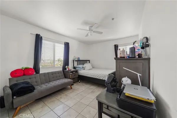 a living room with furniture a rug and a window