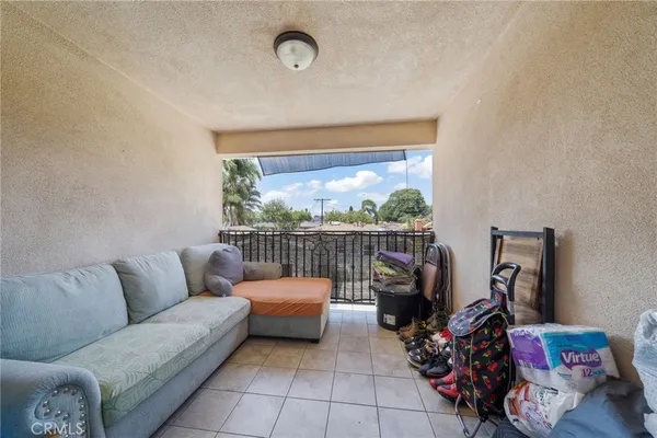 a view of a chairs and table in backyard