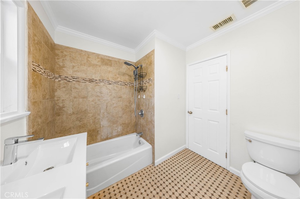 2074 Summit Avenue Pasadena, CA 91103 - Photo 11 of 23 a bathroom with a bathtub and a shower