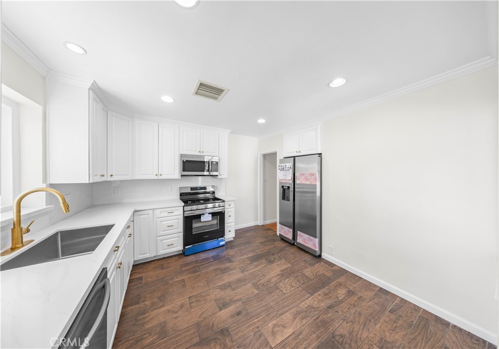 2074 Summit Avenue Pasadena, CA 91103 - Photo 14 of 23 a kitchen with stainless steel appliances granite countertop a refrigerator sink and stove