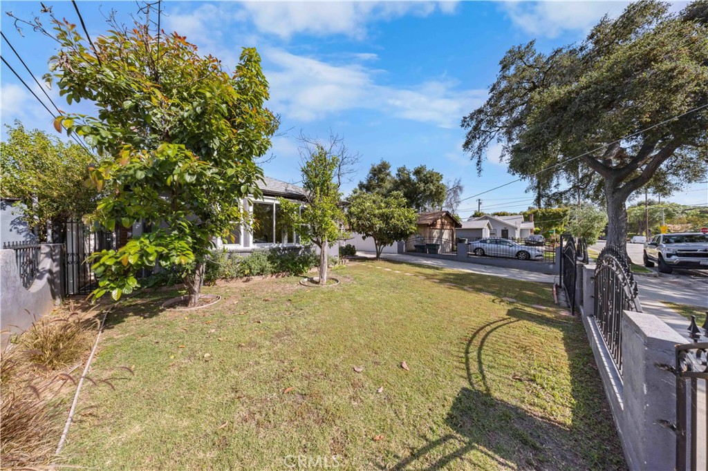 2074 Summit Avenue Pasadena, CA 91103 - Photo 22 of 23 a swimming pool with outdoor seating and yard
