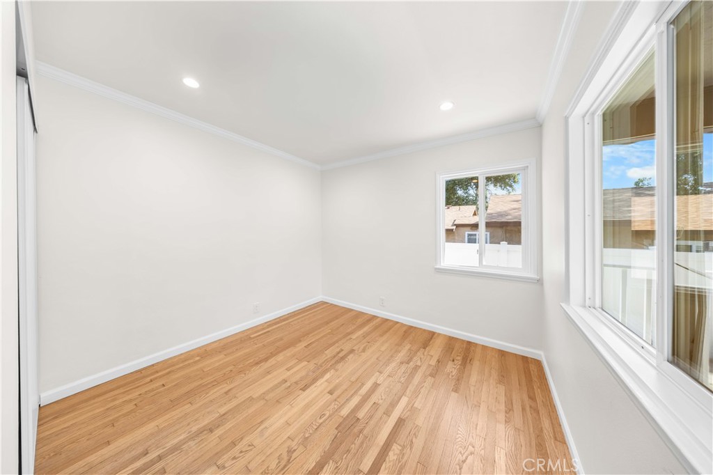 2074 Summit Avenue Pasadena, CA 91103 - Photo 4 of 23 a view of empty room with wooden floor and fan